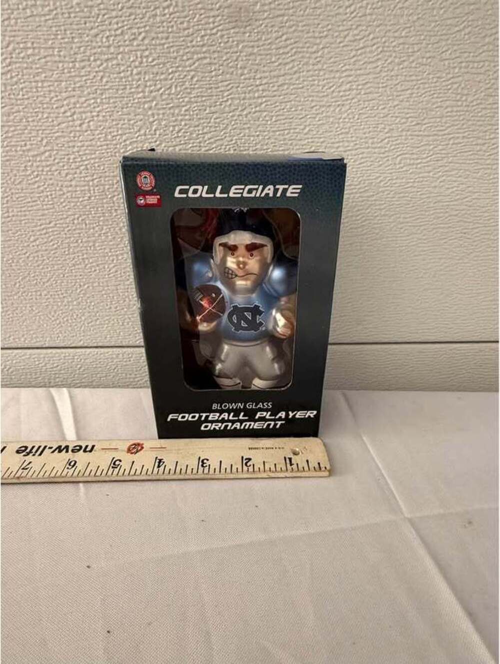 North Carolina Tar Heels Blown Glass Football Player Ornament